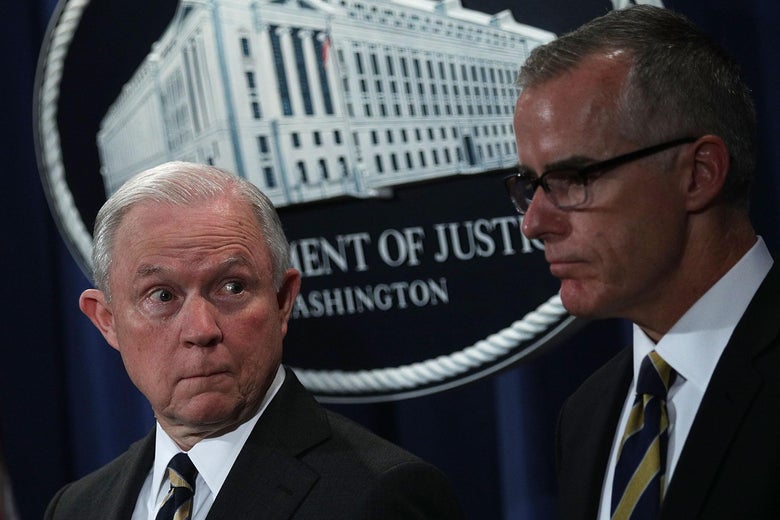 Attorney General Jeff Sessions (L) and then-acting FBI Director Andrew McCabe (R) during a news conference to announce significant law enforcement actions July 13, 2017 at the Justice Department in Washington, D.C.
